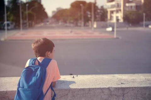 Back to school first day kid carrying backpack walking up school stairs Stock Photos