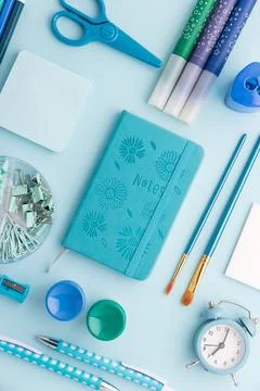 Back to school flat lay with blue stationery Stock Photos
