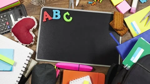 Back To School Flat Lay With Chalkboard, ABC Letters And Colorful School Supplie Stock Footage 343160614