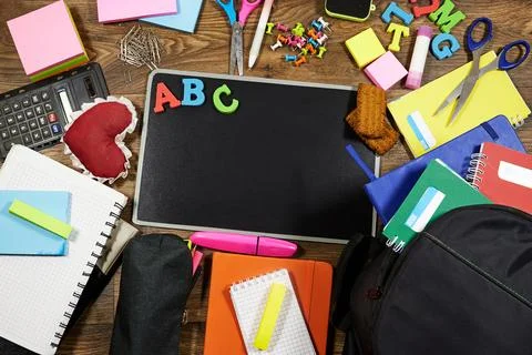 Back To School Flat Lay With Chalkboard, ABC Letters And Colorful School Supplie Stock Photos