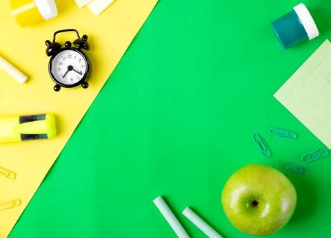 Back to school flat lay with copy space on green and yellow 스톡 사진