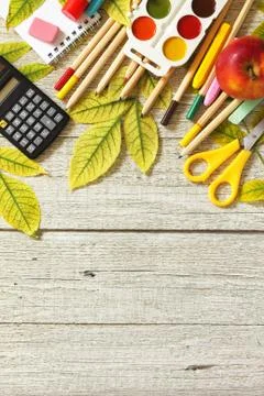 Back to school. Flatlay background. Table with autumn leaves, apple. Stock Photos