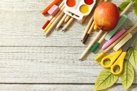 Back to school. Flatlay background. Table with autumn leaves, apple. Stock Photos