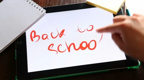 Back to school, hand writes on tablet at workplace 動画素材 62953656