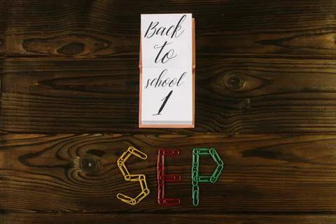 Back to school hero header with school supplies on wooden table, copy space on Stock Photos