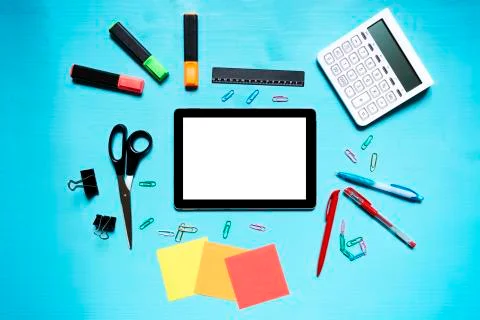 Back to school. Items for the school on a blue wooden table. Stock Photos