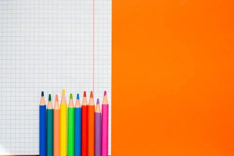 Back to school. Items for the school on a orange table. Stock Photos