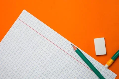 Back to school. Items for the school on a orange table. Stock Photos