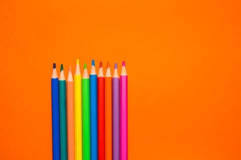 Back to school. Items for the school on a orange table. Stock Photos