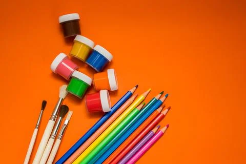 Back to school. Items for the school on a orange table. Stock Photos