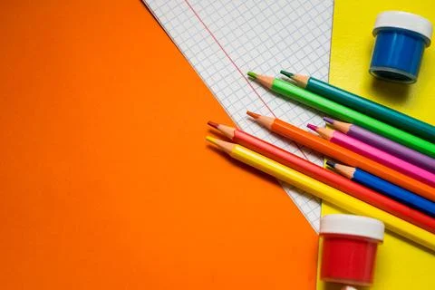 Back to school. Items for the school on a orange table. Stock Photos