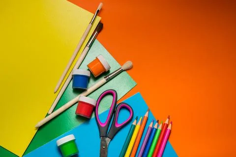 Back to school. Items for the school on a orange table. Stock Photos