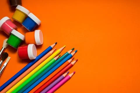 Back to school. Items for the school on a orange table. Stock Photos