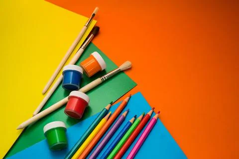 Back to school. Items for the school on a orange table. Stock Photos