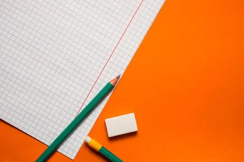 Back to school. Items for the school on a orange table. Stock Photos
