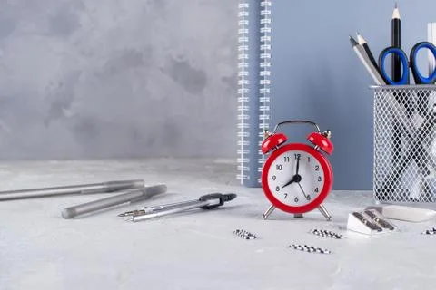 Back to school. Items for the school, red alarm clock Stock-Fotos