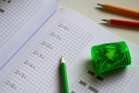 Back to school, learning to write letters correctly, notebook and pencils Stock Photos