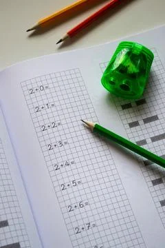 Back to school, learning to write letters correctly, notebook and pencils Stock Photos