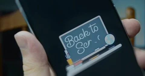Back to school lettering on a blackboard in classroom, presentation Stock Footage 313499316