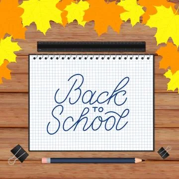 Back to school lettering hand written in a notebook. Wooden texture backgroun Stock Illustration