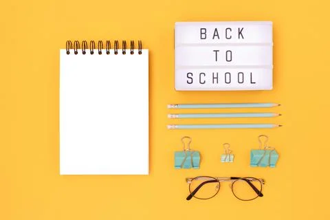 Back to school. Lightbox with letters and mint colored stationery. Stock Photos
