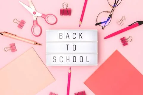 Back to school. Lightbox with letters and frame made of stationery. Stock Photos