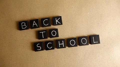 Back to school message on brown paper background Stock Photos