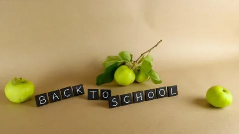 Back to school message with fresh green apples Stock Photos