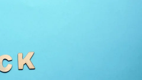 Back to school message from the wooden letters on the blue background. Letters  Stock-Footage 131247957