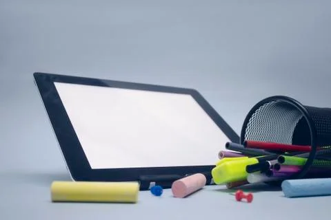 Back to school. Mock up tablet with drawing tools and other stationery on the Stock Photos