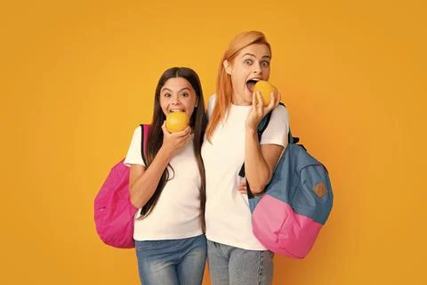 Back to school. Mother and daughter teen girl in with backpack. Teenagers Stock Photos