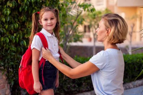 Back to school. Mother escorting her child to school Stock Photos