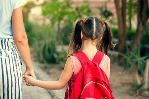 Back to school. Mother escorting her child to school Stock Photos