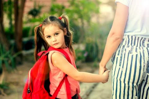 Back to school. Mother escorting her child to school Stock Photos