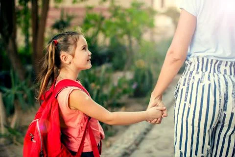 Back to school. Mother escorting her child to school Stock Photos