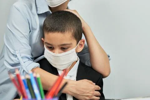 Back to school. Mother preparing son to school. Mom hugging schoolboy Stock Photos