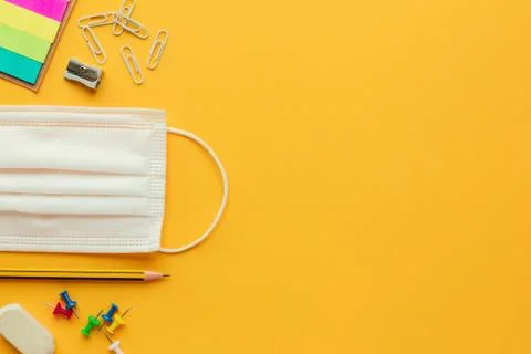 Back to school in the new normal with a face mask and stationery Stock Photos