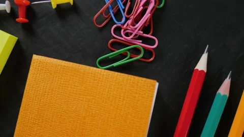 Back to school. Note paper, paper clips, pins. space for text Stock Footage 155810128