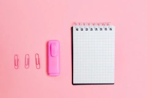 Back to school. Notepad, marker and clips on pink background. Flat lay. Mock  Stock Photos