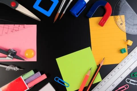 Back to School. Office objects over blackboard background. Stock Photos