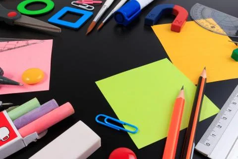 Back to School. Office objects over blackboard background. Stock Photos
