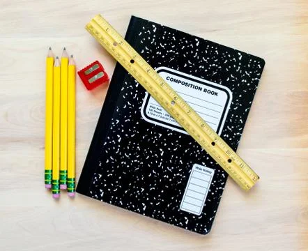 Back to school- pencils, notebook, ruler and sharpener on a wooden desk Stock Photos