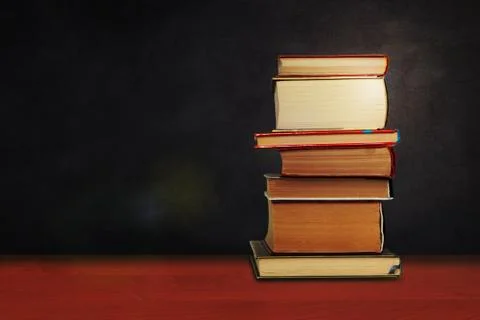 Back to school, pile of books with empty green school board background, educa Stock Photos