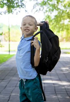 Back to school. Portrait of an elementary school student on the way to study. Stock Photos