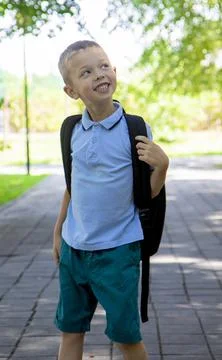 Back to school. Portrait of an elementary school student on the way to study. Stock Photos