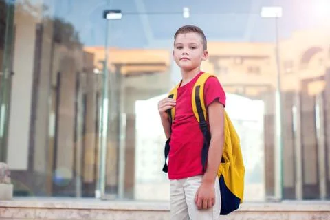 Back to school. Pupil with backpack ready to school staying outdoor Foto stock