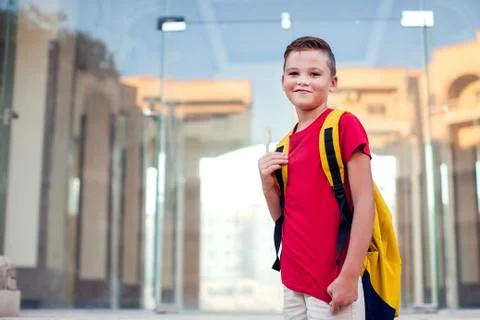Back to school. Pupil with backpack ready to school staying outdoor Stock Photos