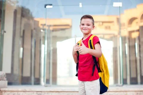 Back to school. Pupil with backpack ready to school staying outdoor Stock Photos