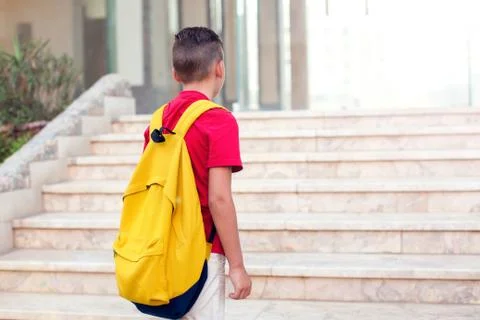 Back to school. Pupil boy with backpack going to school Stock Photos