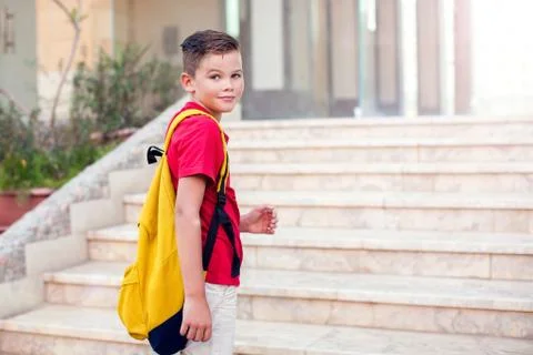 Back to school. Pupil boy with backpack going to school Stock Photos